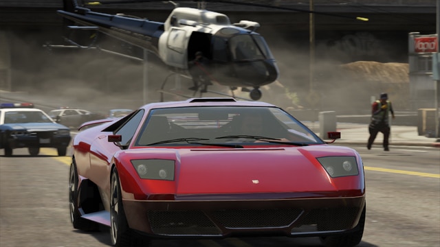Cena de Grand Theft Auto V com carro esportivo e helicóptero em Los Santos